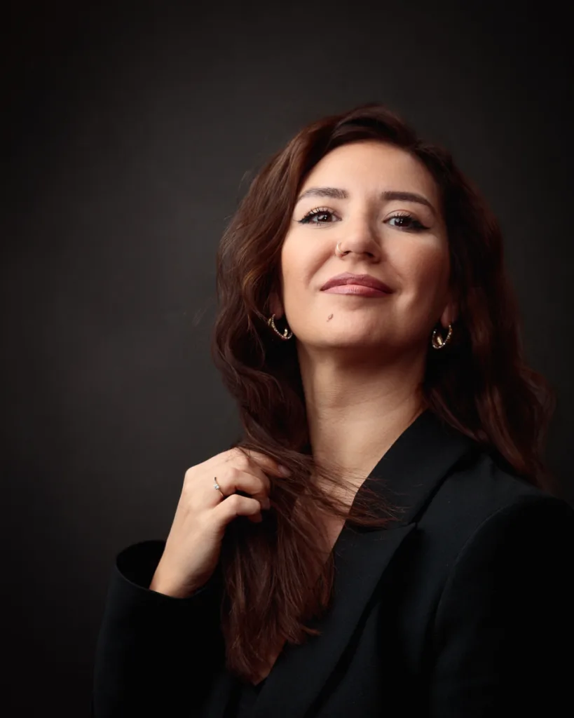 Confident woman in black blazer portrait