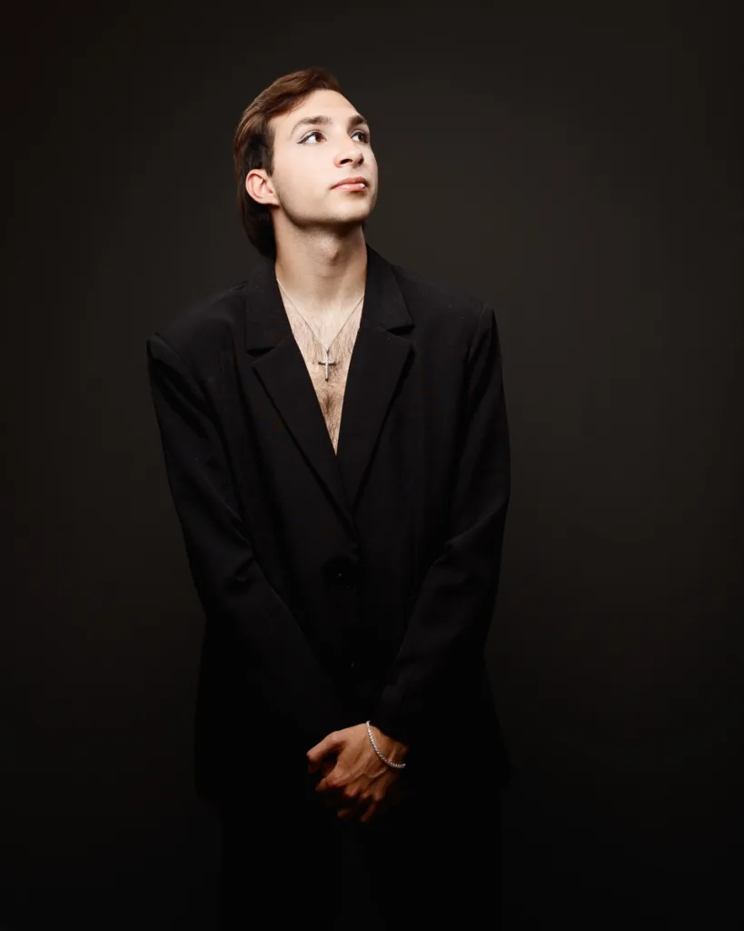 Person in suit with contemplative expression.