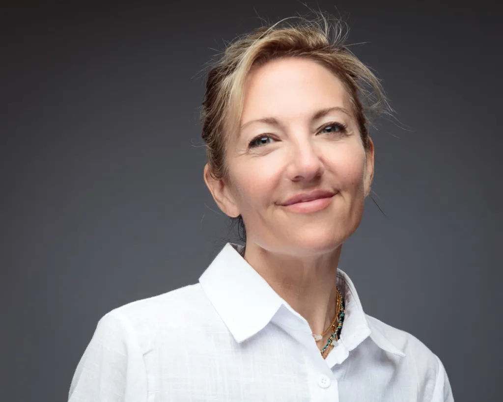 Smiling woman in white shirt, casual portrait