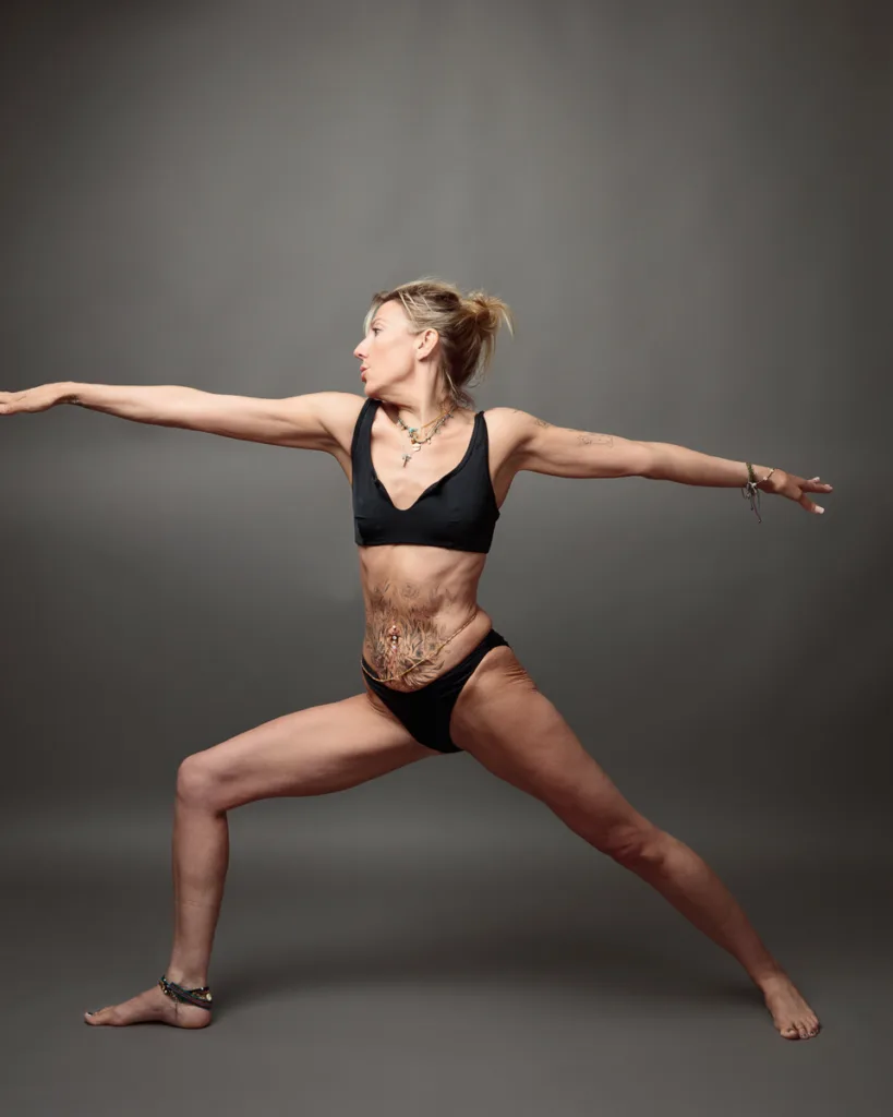 Woman practicing yoga in warrior pose.