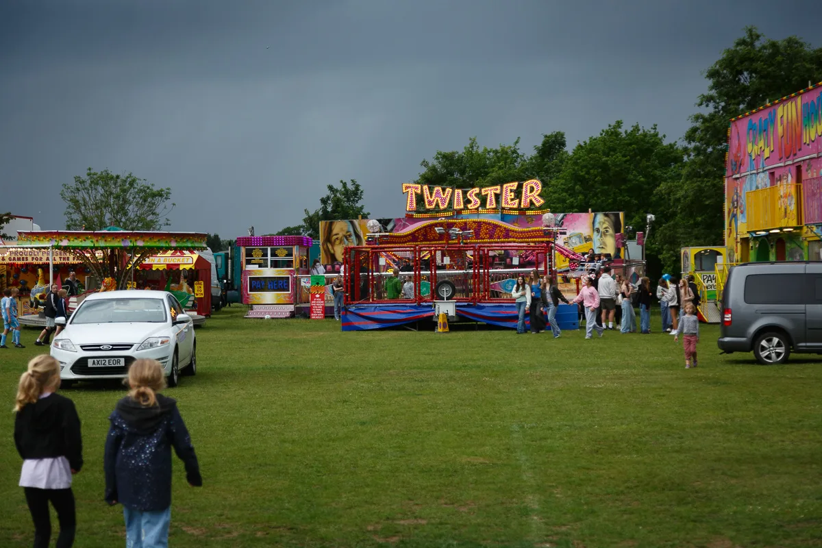 Funfair with Twister ride and people