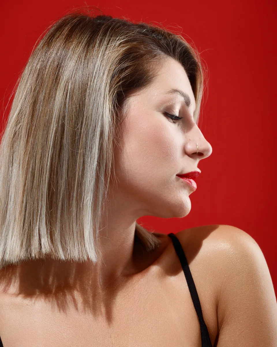 Profile of woman with blonde bob hairstyle