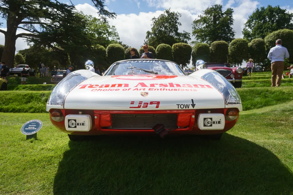 Classic race car displayed at outdoor event.