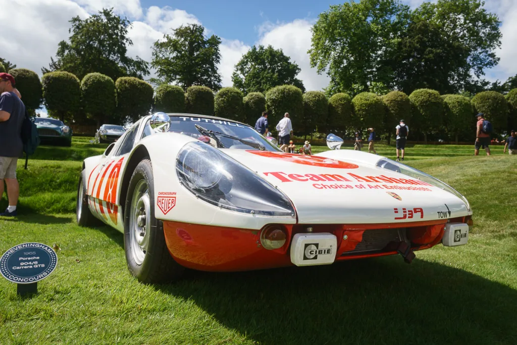 Classic Porsche racing car on display outdoors.