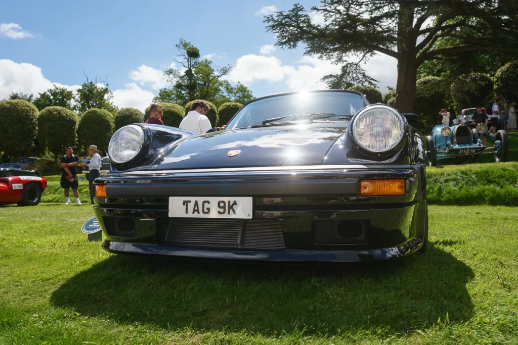 Classic Porsche car at outdoor show on grass