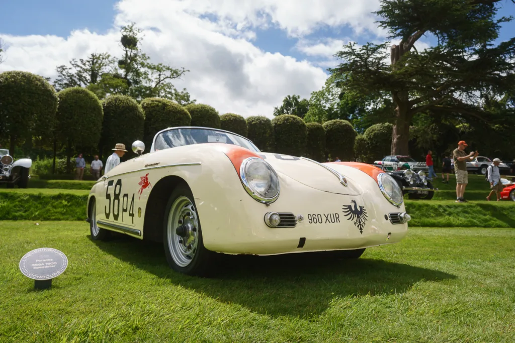 Vintage Porsche sports car on display outdoors.