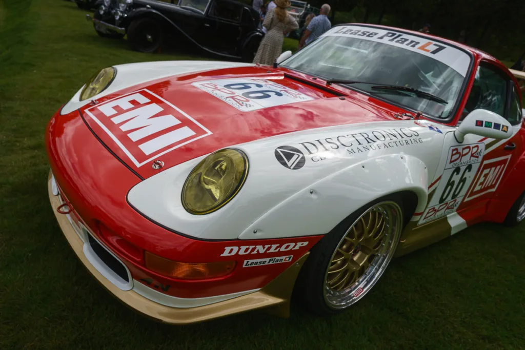 Classic racing car with EMI branding on display