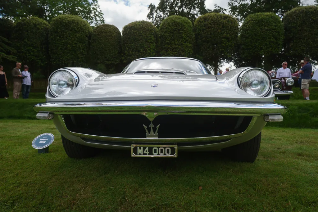Front view of classic Maserati on grass.