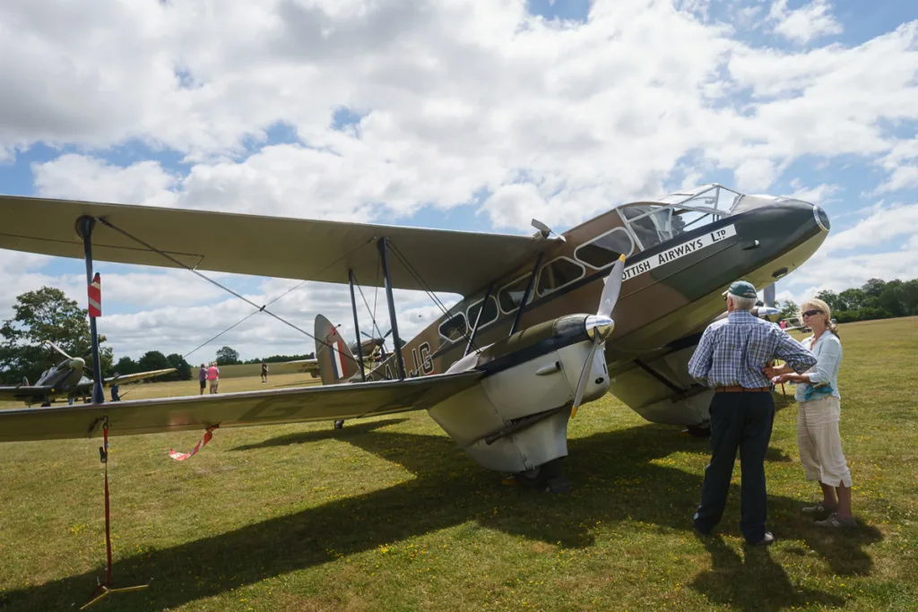 Vintage aircraft with people at airshow