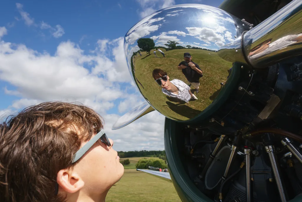 Reflection in shiny airplane engine cowling