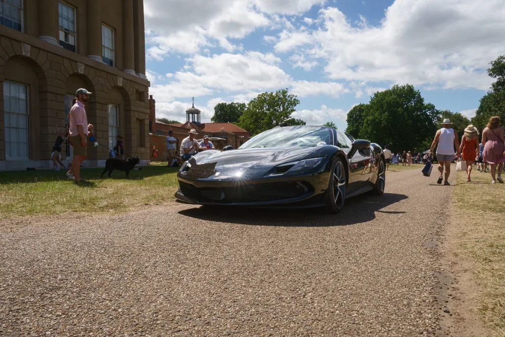 Black sports car at outdoor event