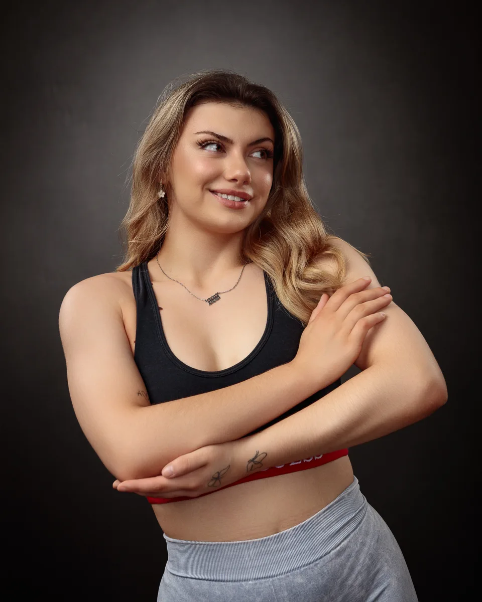 Woman posing confidently in athletic attire