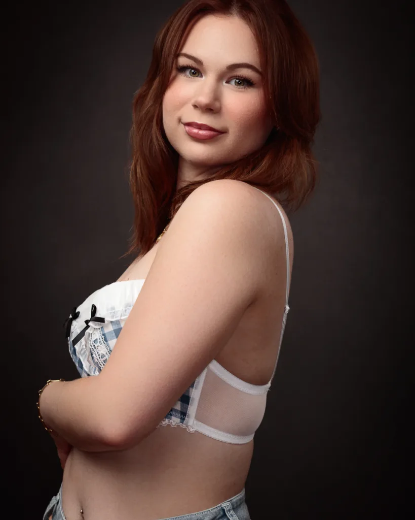 Woman posed in checkered and lace lingerie.