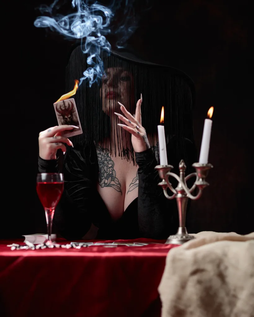 Mysterious woman with tarot cards and candles