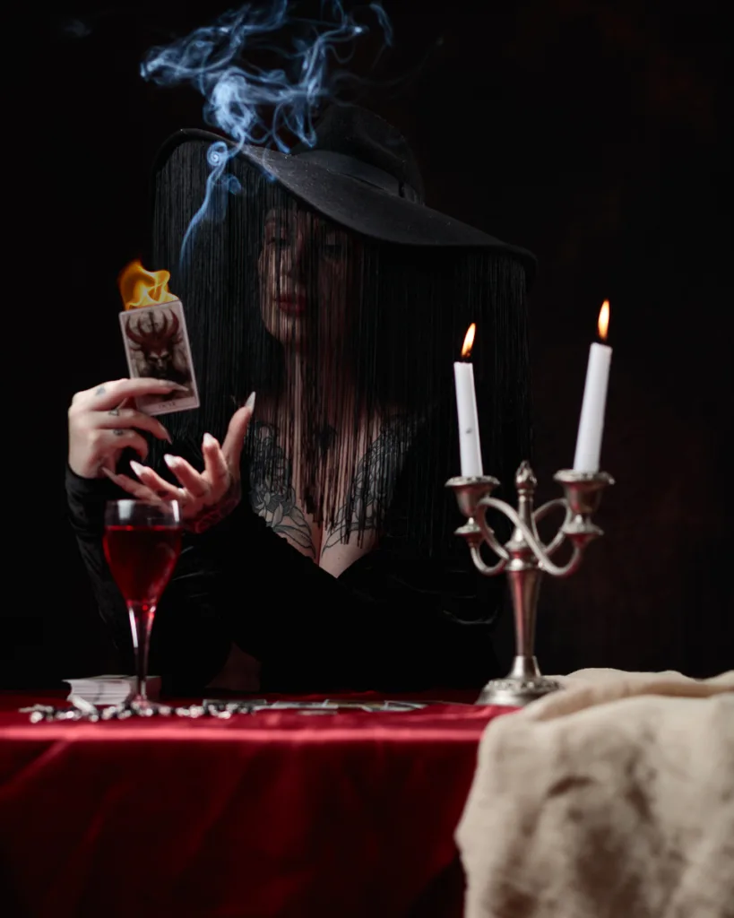Mysterious woman with tarot cards and candles.