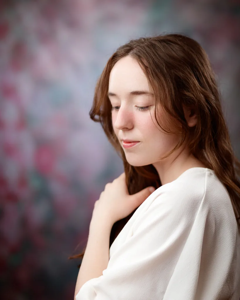 Woman in white blouse with blurred background