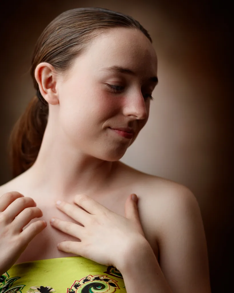 Woman with brown hair looking down