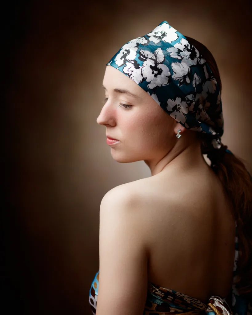 Woman with floral headscarf facing side