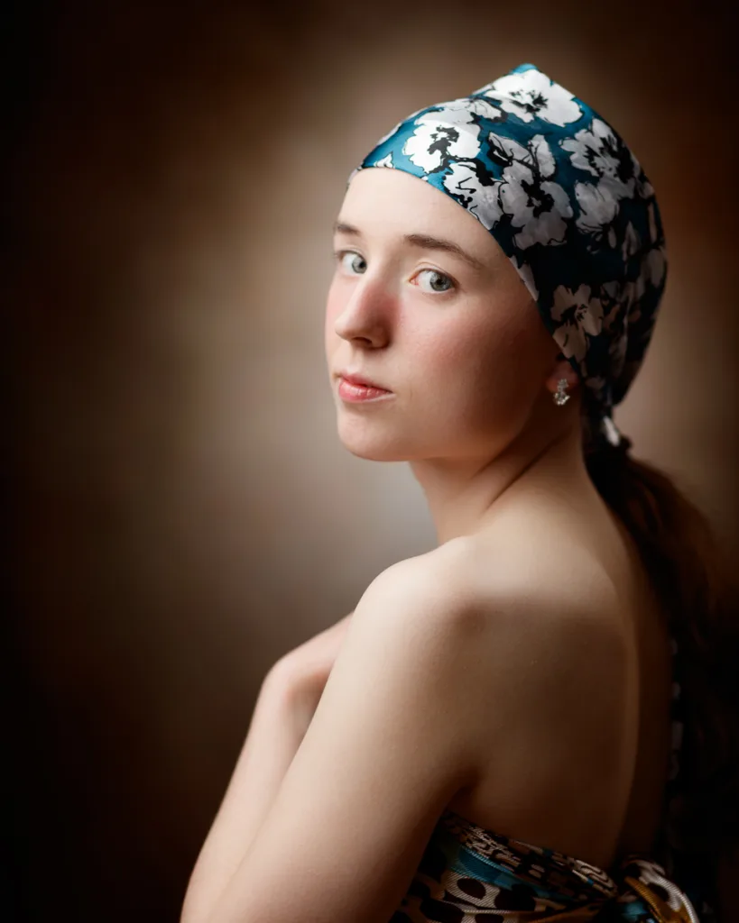 Woman with headscarf looking over shoulder portrait