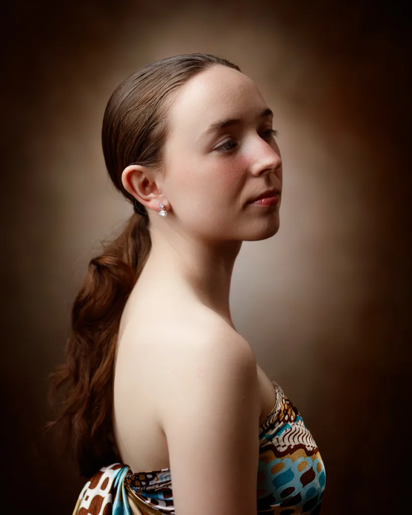 Woman posing in elegant, colourful strapless dress