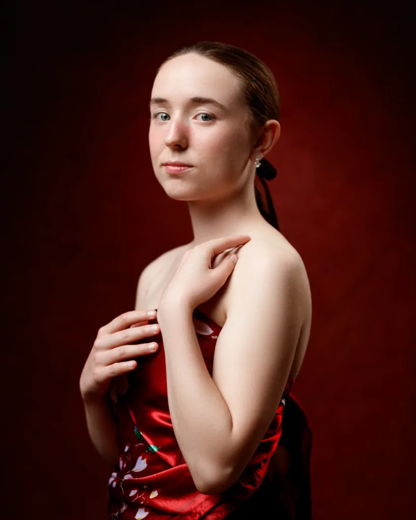 Portrait of a woman in a red dress.