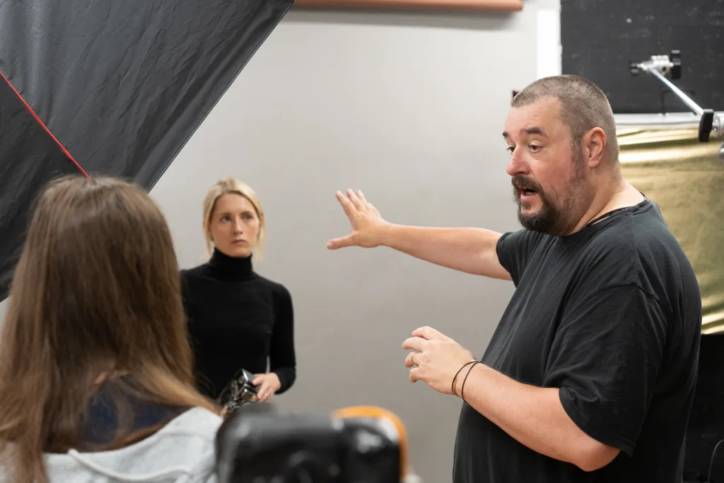 Photography studio discussion during a photoshoot session.