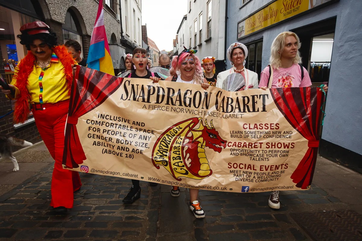 Snapdragon Cabaret parade with inclusive banner, Norwich.