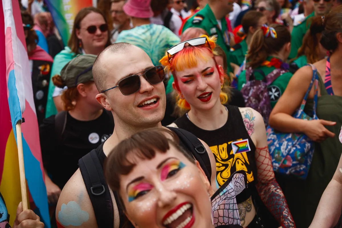Colourful crowd celebrating at a pride parade.