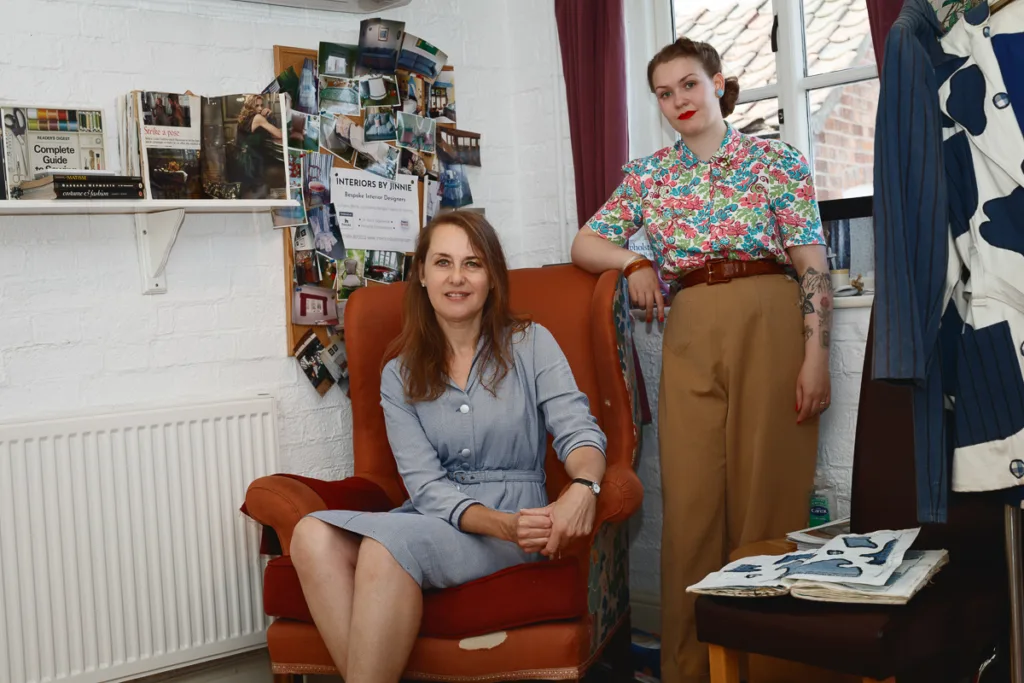 Women in interior design studio with decoration samples.
