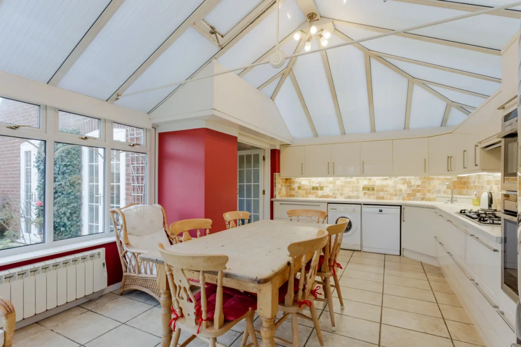 Spacious modern kitchen with conservatory roof