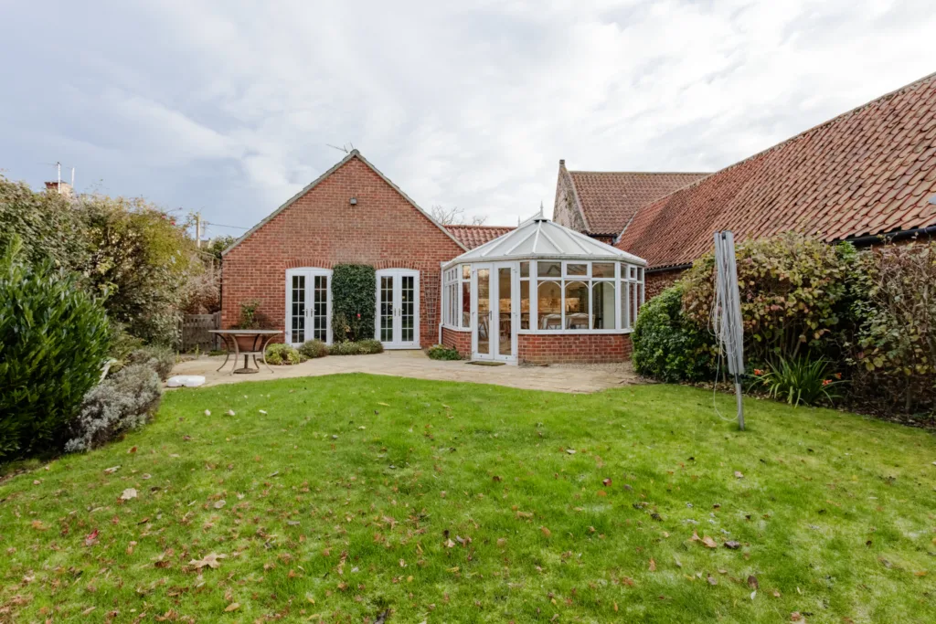 Brick home with conservatory and garden