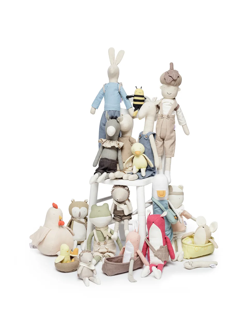 Assorted plush animal toys on a white background.