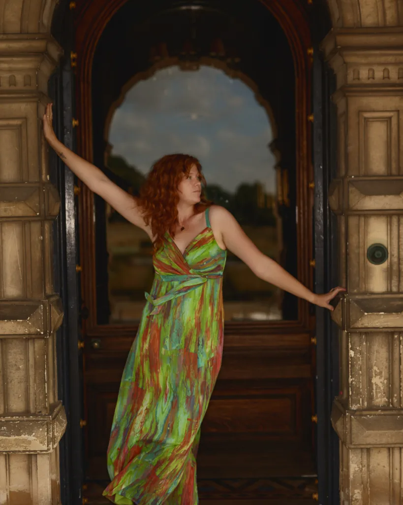 Woman in colourful dress standing in doorway
