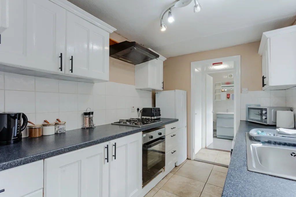 Modern kitchen with white cabinets and appliances