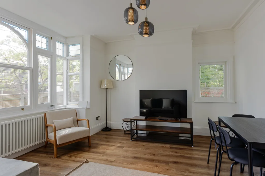 Modern living room with large windows.