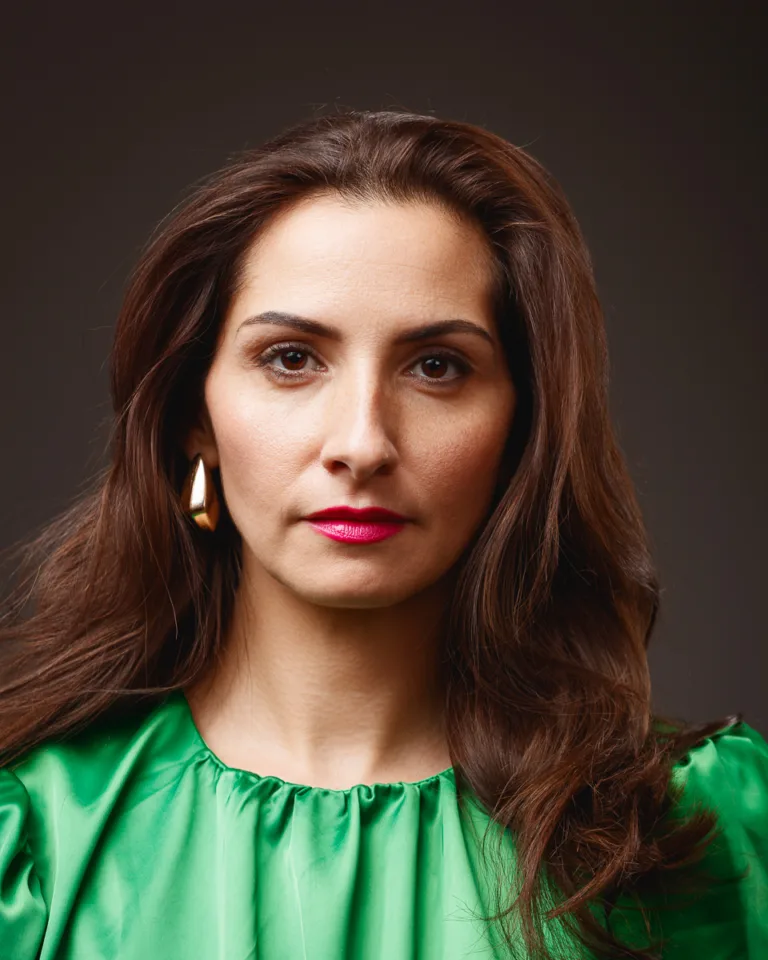 Woman in green blouse with brown hair
