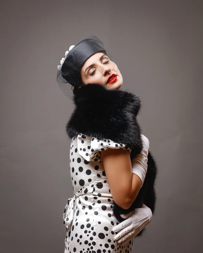 Vintage woman in polka dot dress and hat