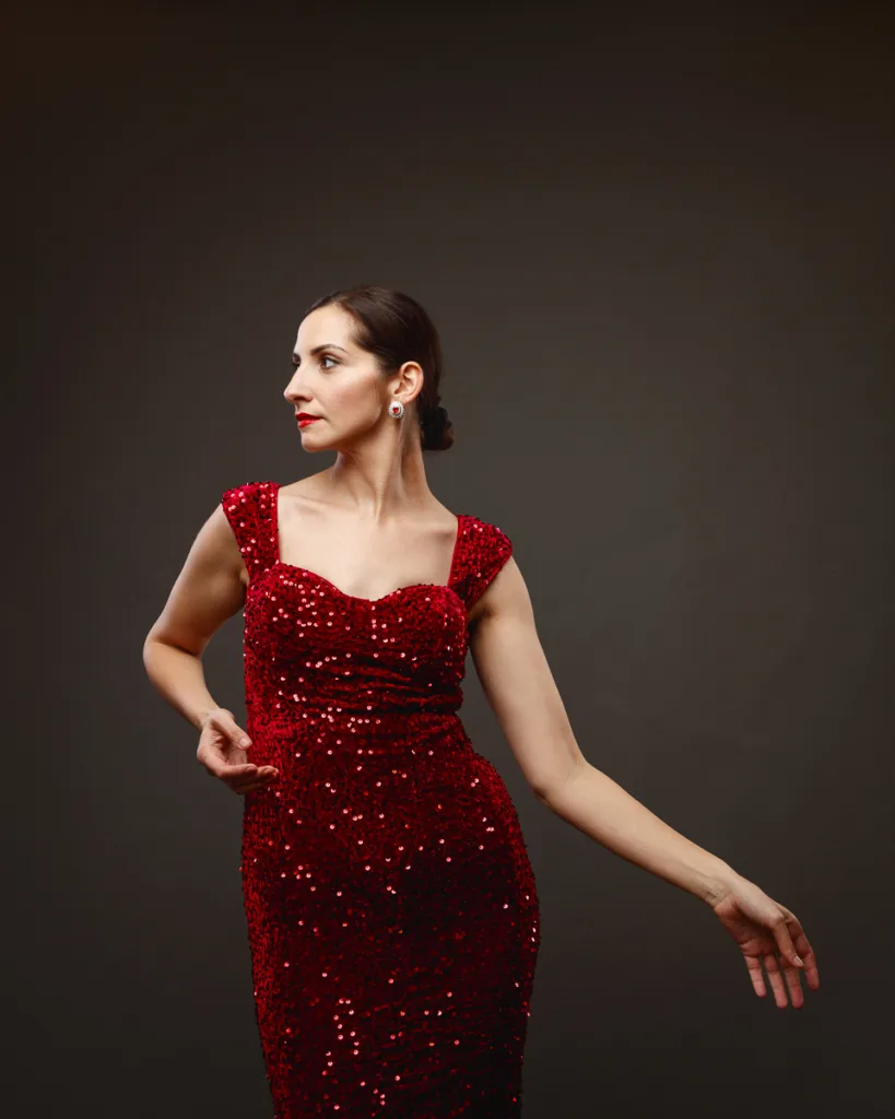 Woman in elegant red sequined dress