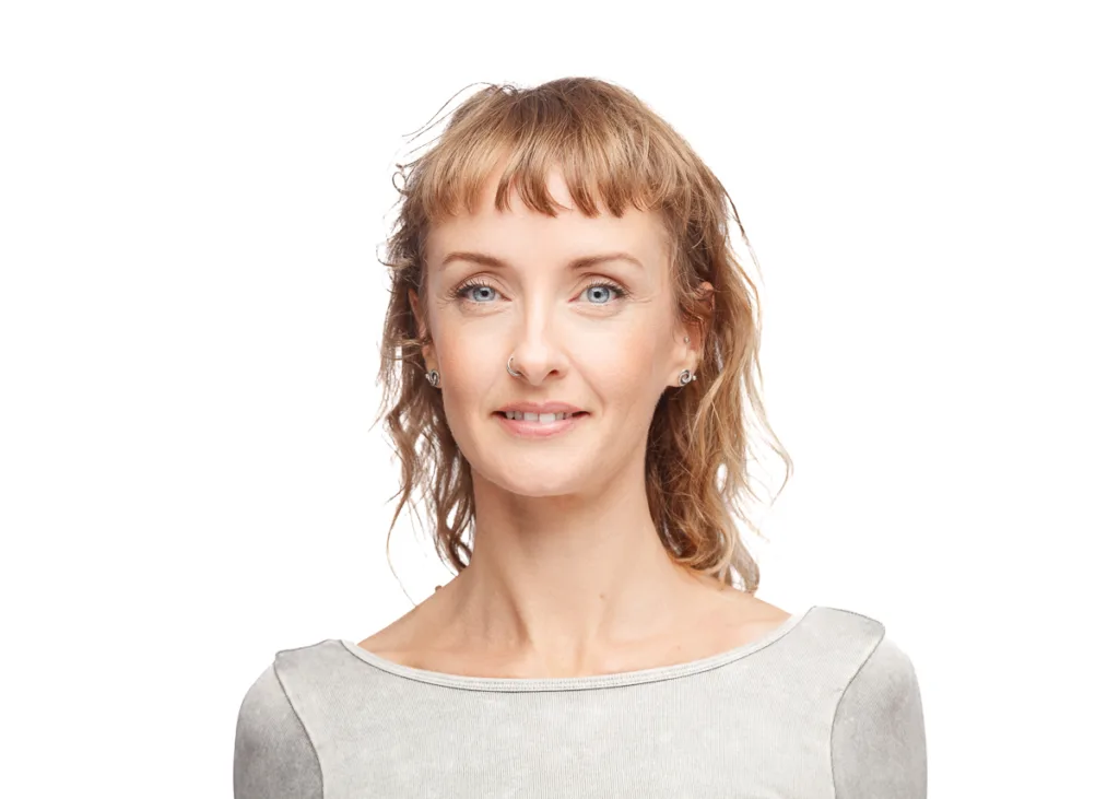 Smiling woman with earrings and nose ring