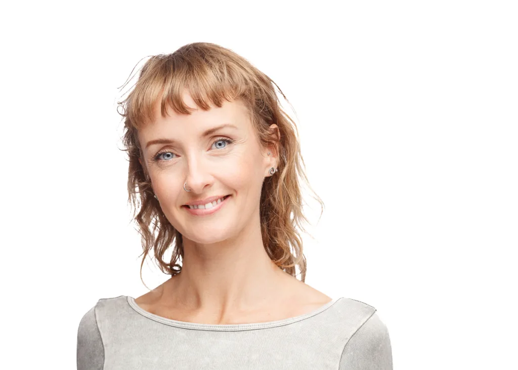Smiling woman with brown hair.