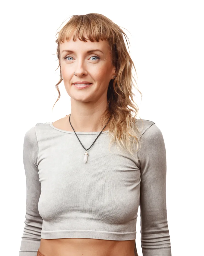 Woman in grey shirt with crystal necklace