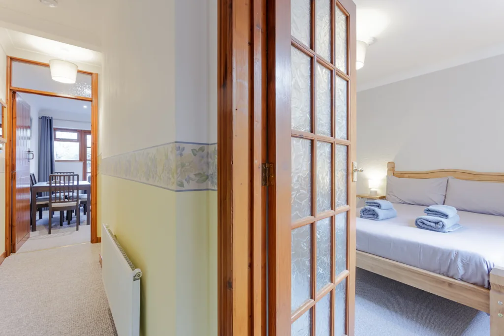 Hallway leading to dining area and bedroom.