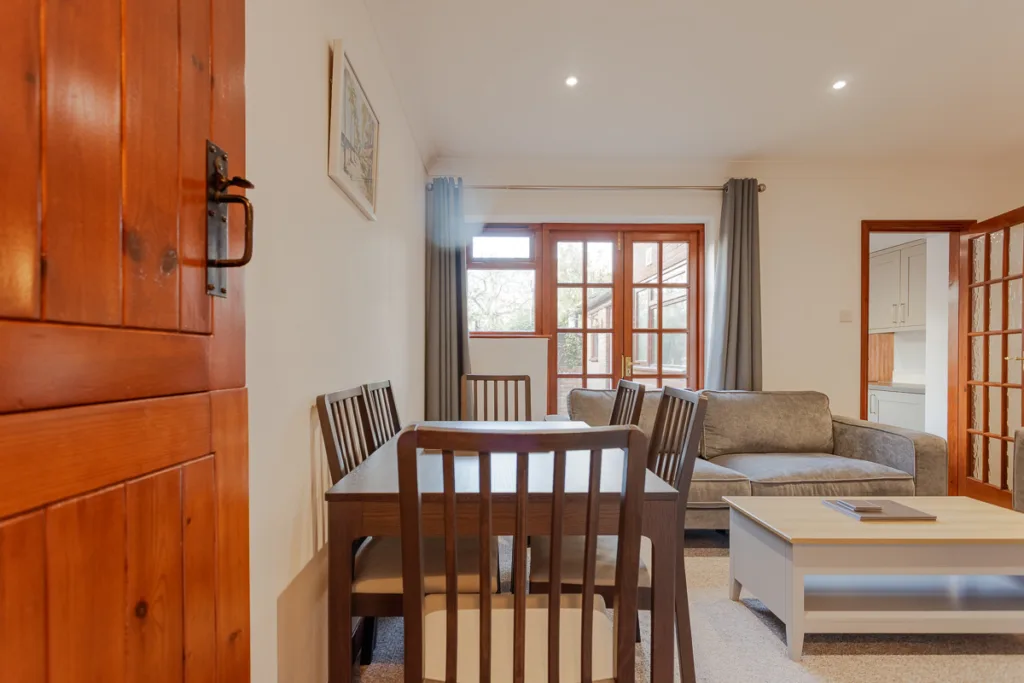 Bright living room with dining table and sofa.