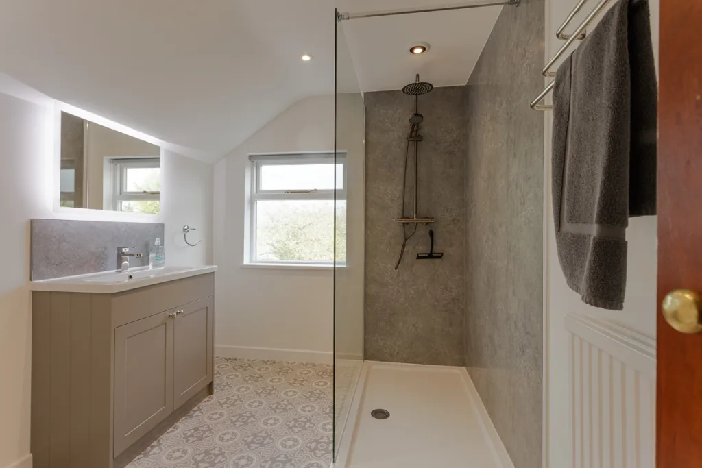 Modern bathroom with shower and vanity unit