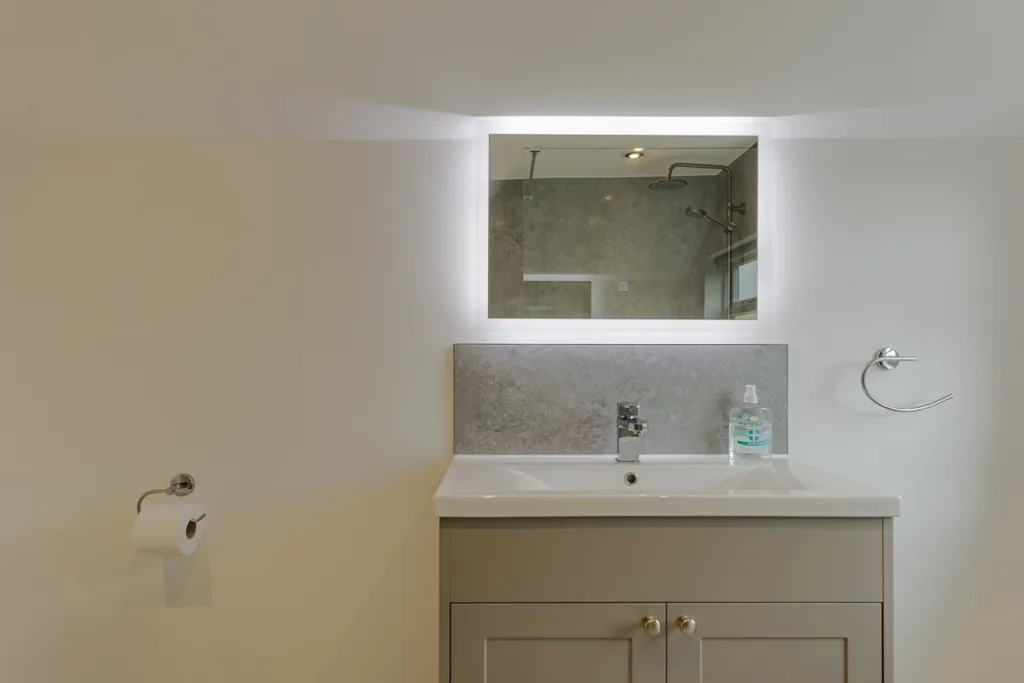 Modern bathroom sink with illuminated mirror