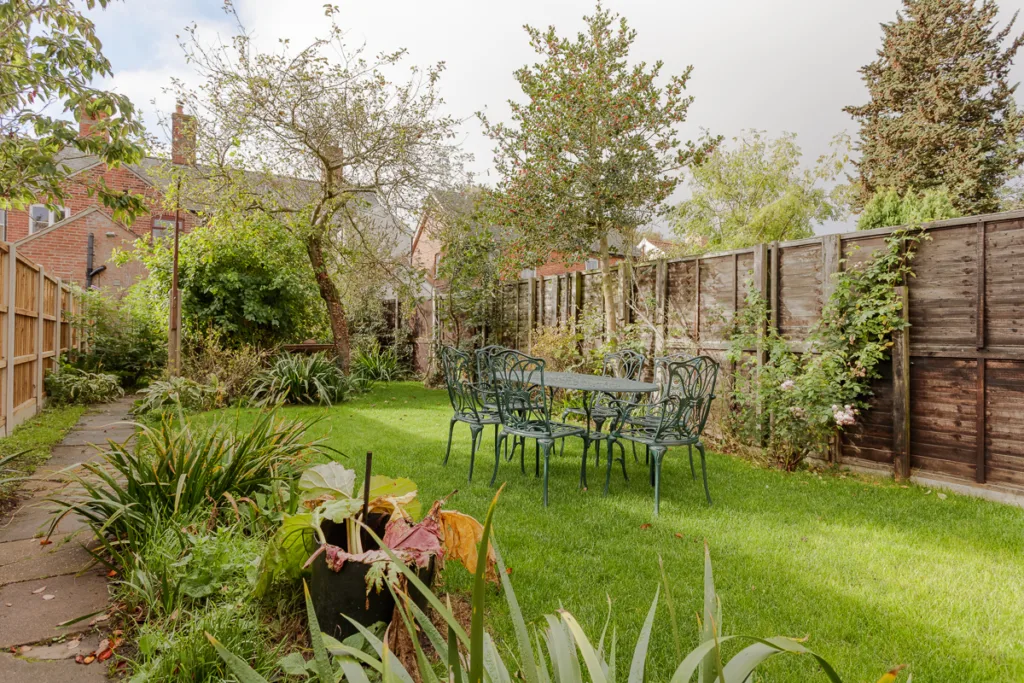 Sunny garden with table and chairs
