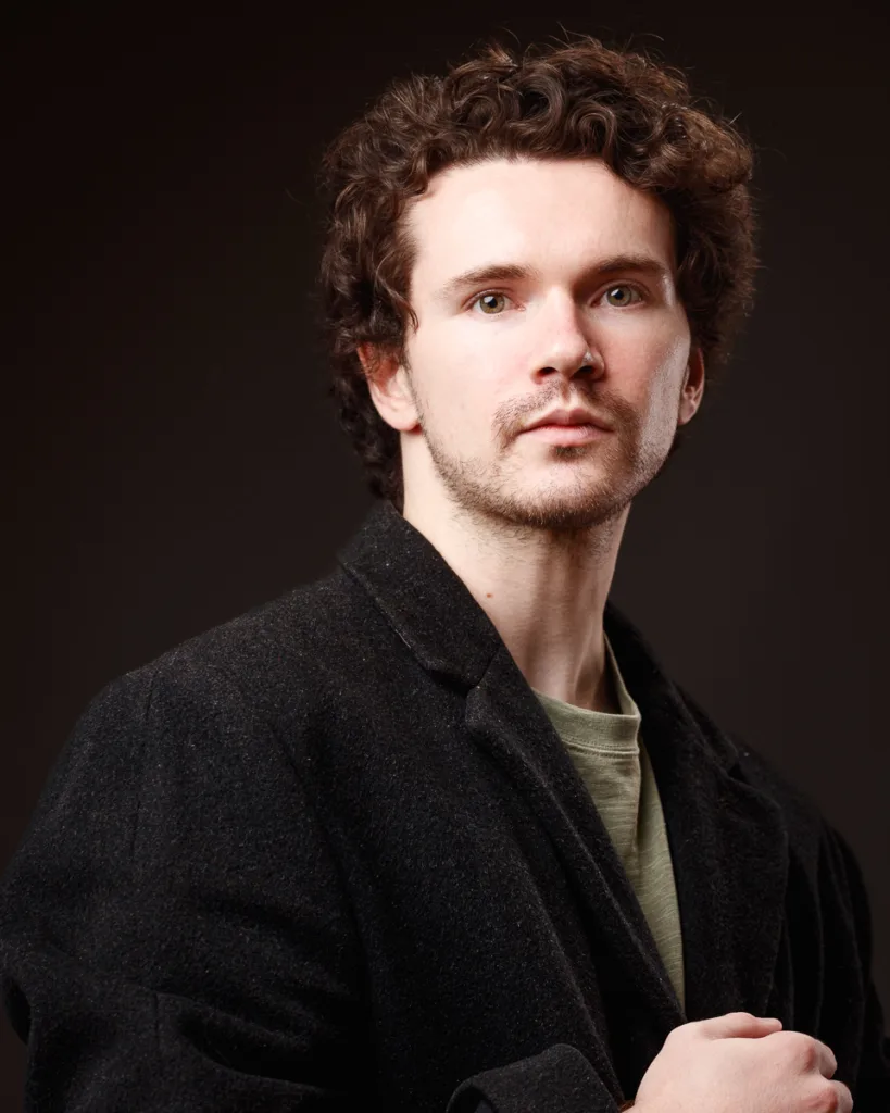 Portrait of a man in a black jacket.