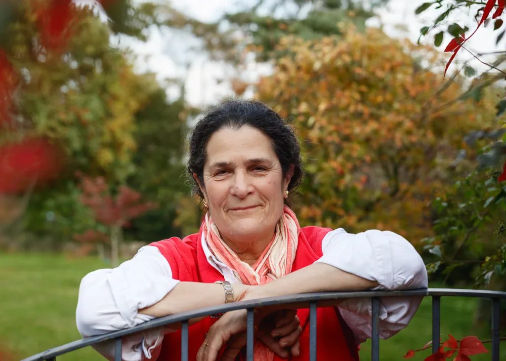 Smiling woman in autumn garden setting