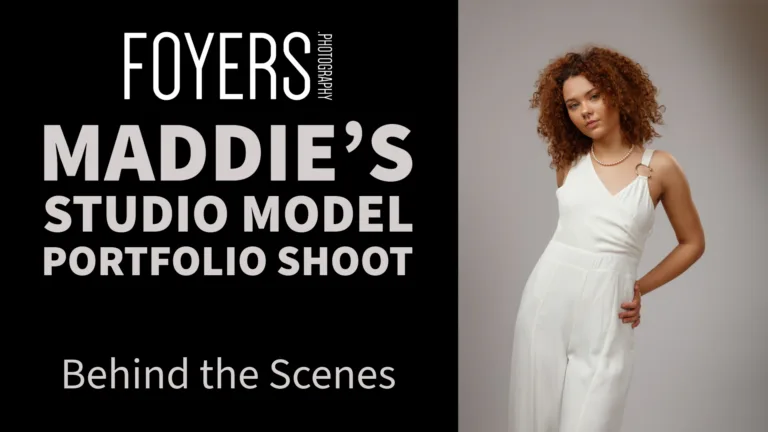Model posing in white jumpsuit studio photoshoot