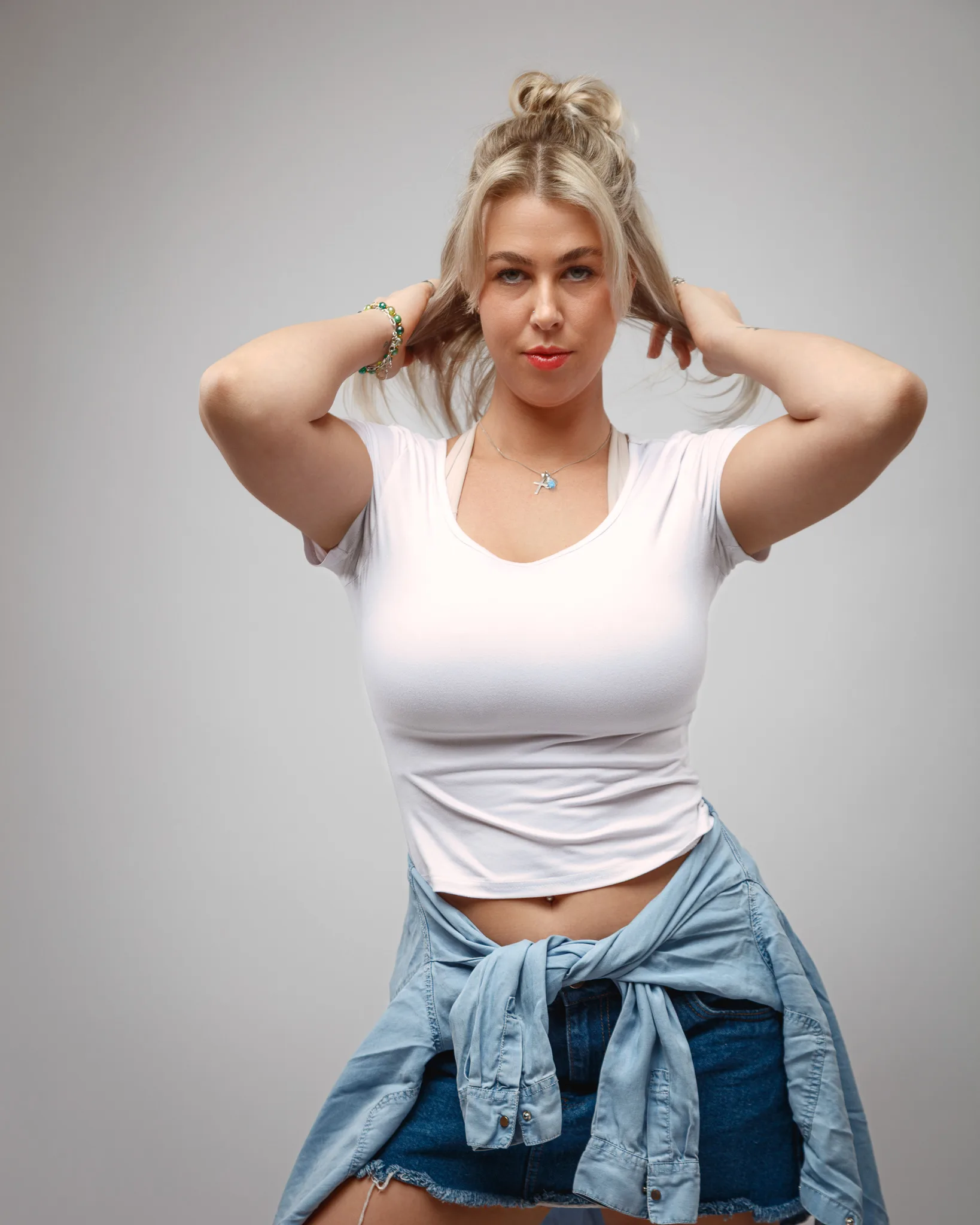 Woman posing confidently in casual outfit
